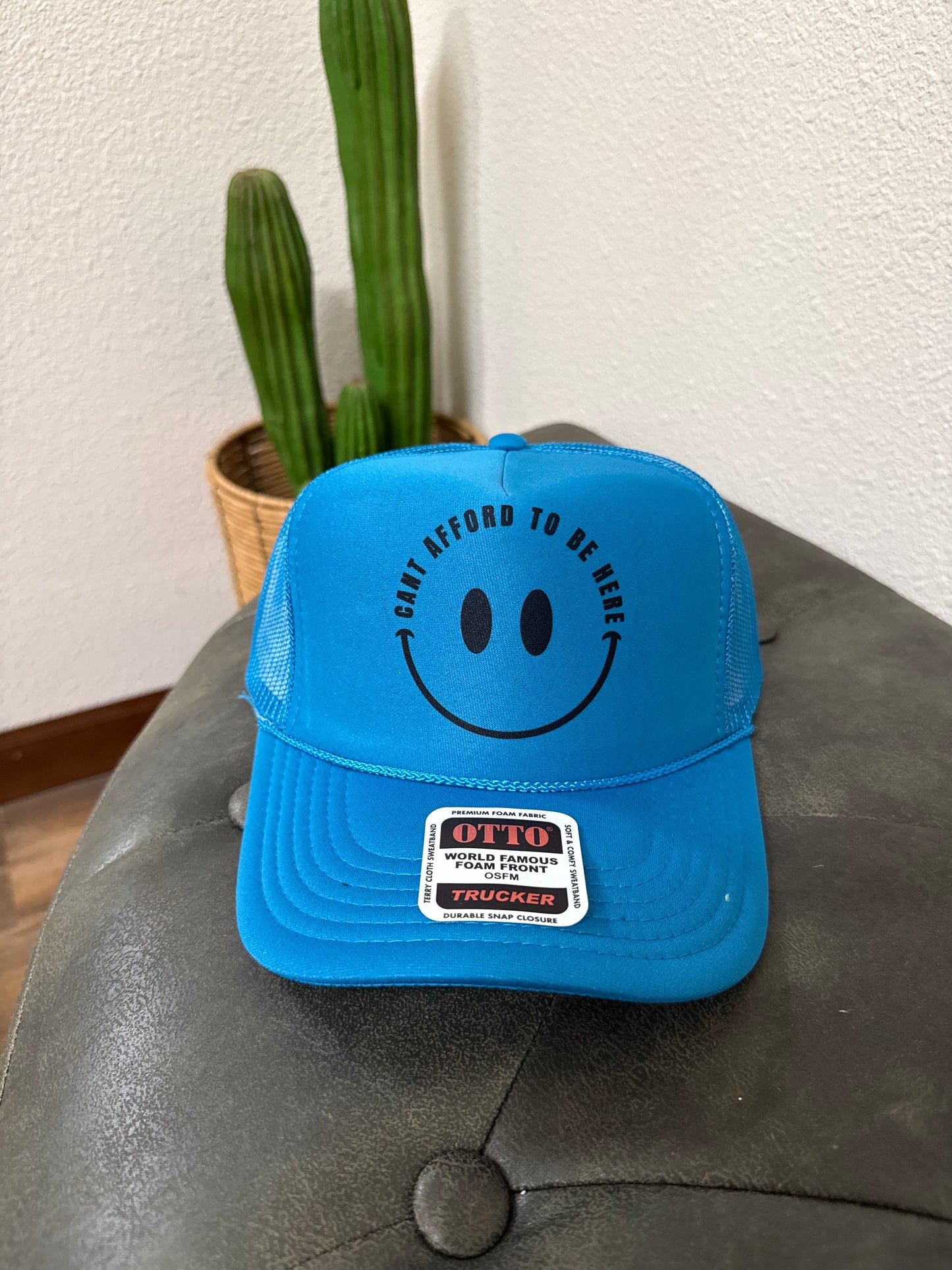 I Can’t Afford to Be Here Trucker Hat